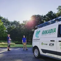 arkadia pest technicians outside of their service van